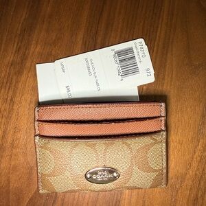 Coach Slim Id Card Case
In Signature Canvas